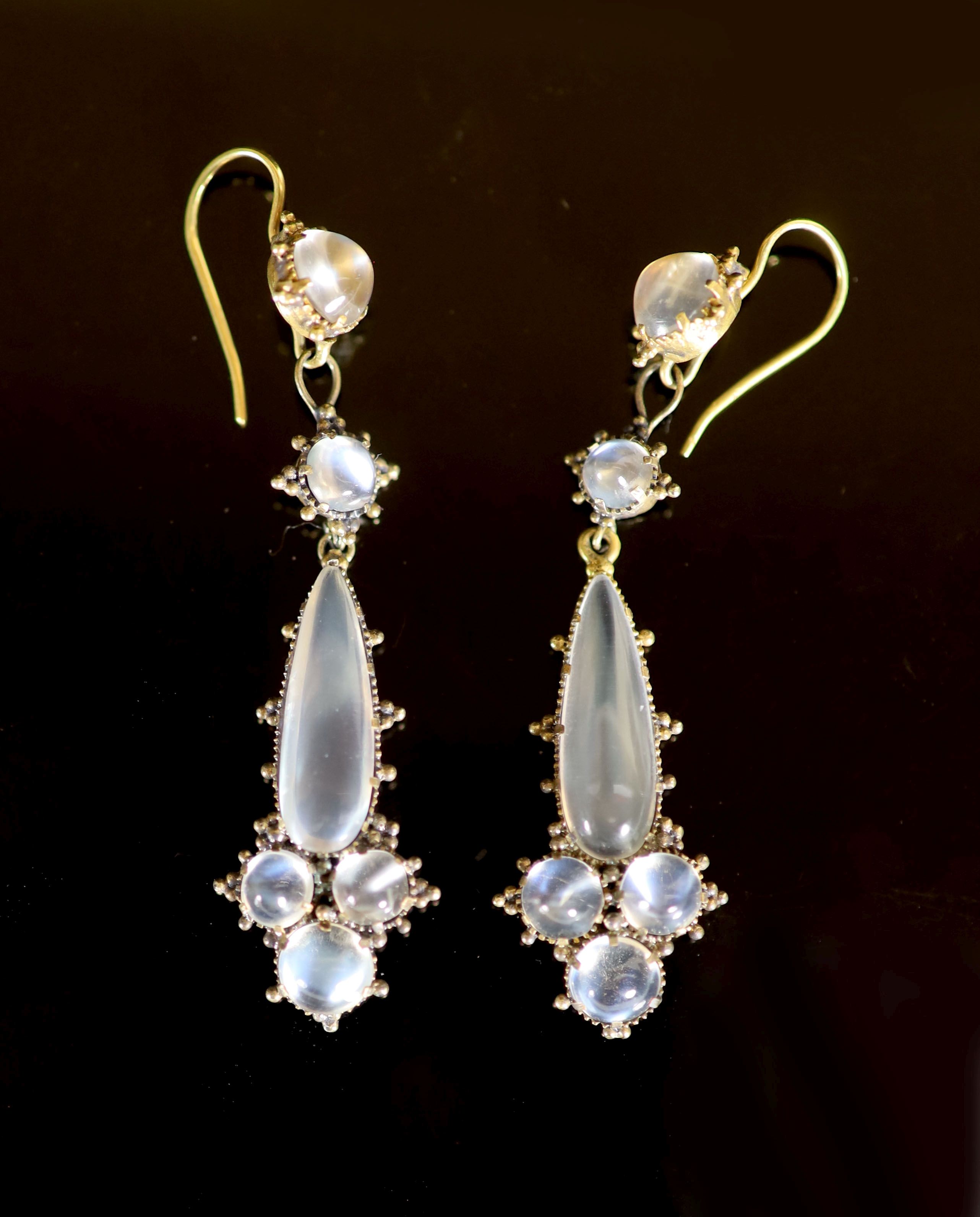 A pair of early 20th century gold and six stone cabochon moonstone set drop earrings